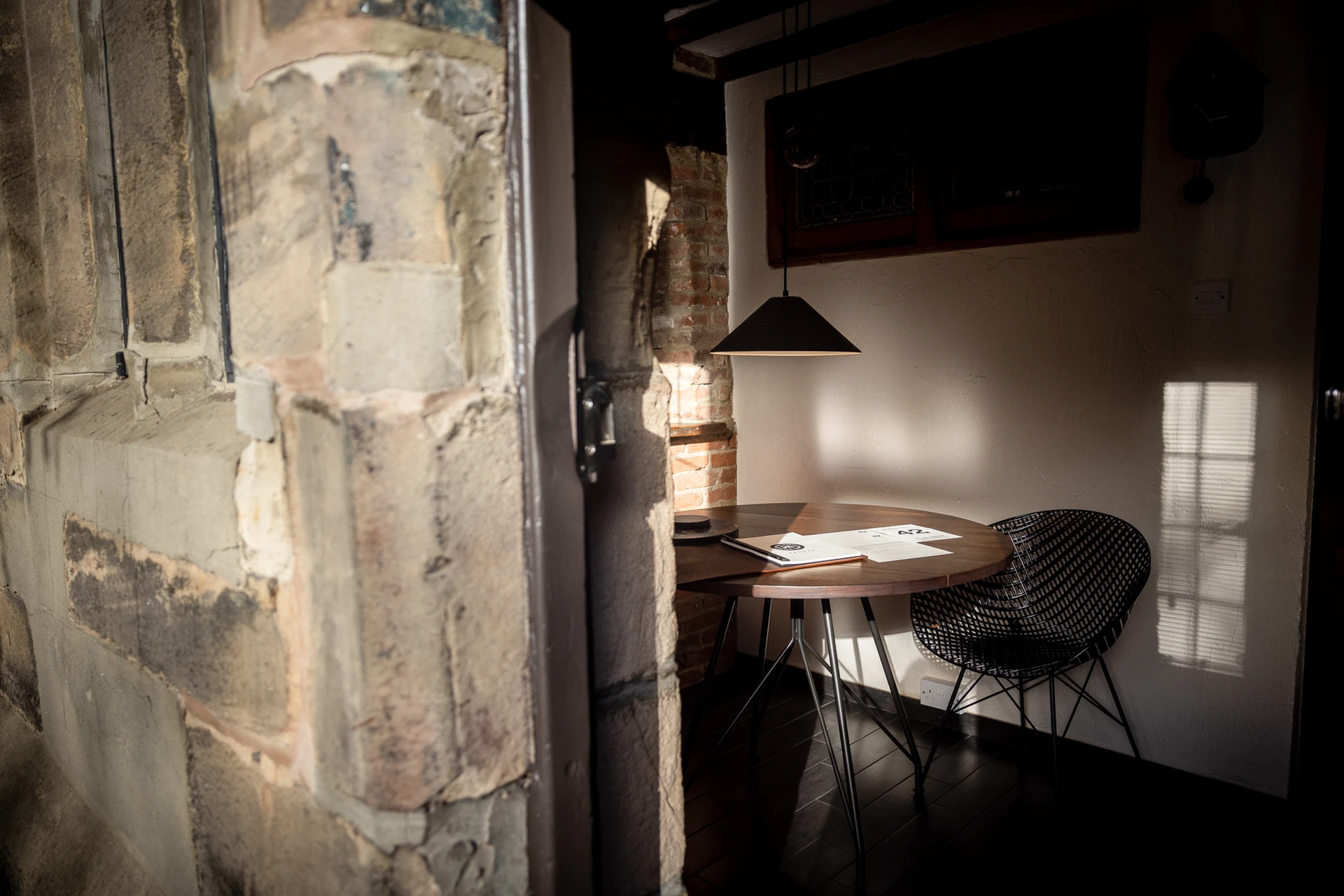 Dining table beside the stone doorway at 42 Church Street