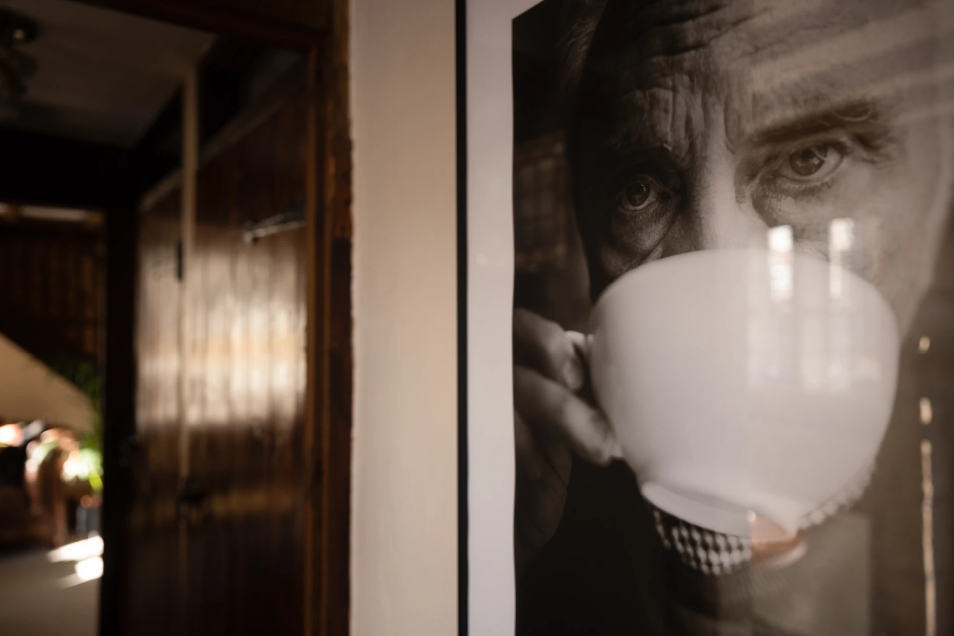 Framed portrait and warm interior light at 42 Church Street