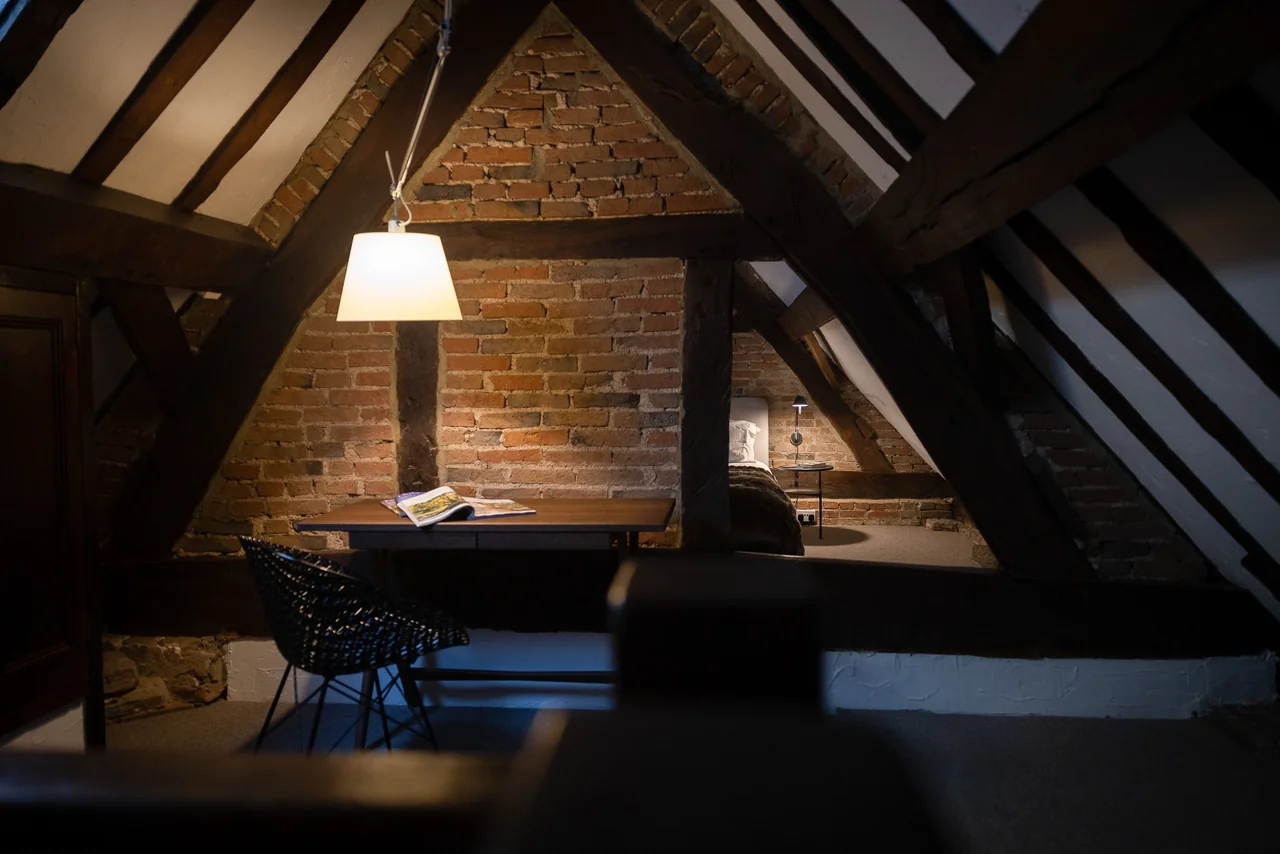 Exposed roof timbers and writing desk at 42 Church Street