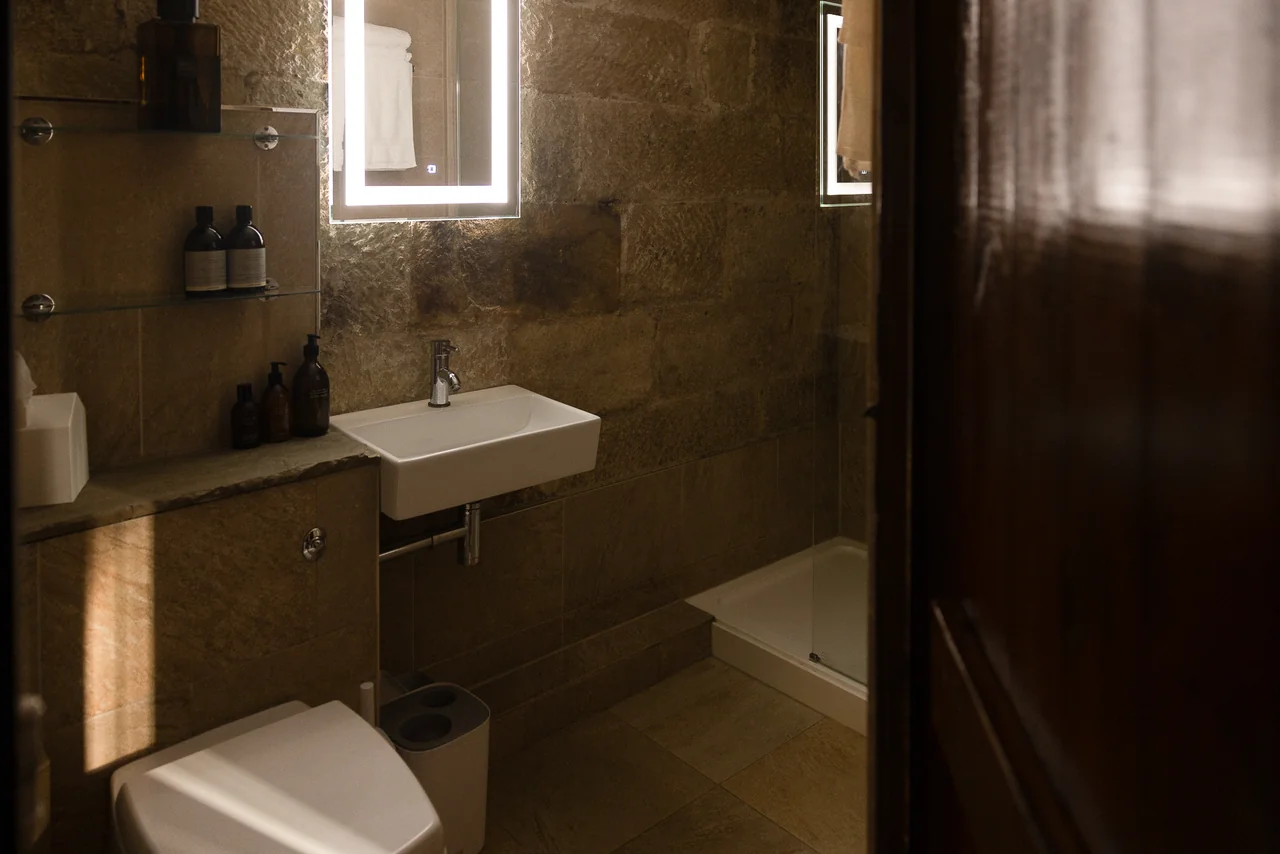 Bathroom basin and stone window at 42 Church Street