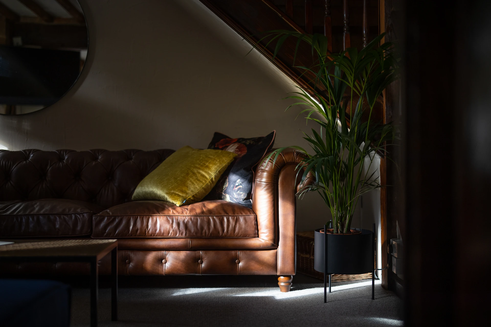 Leather sofa beneath the staircase at 42 Church Street
