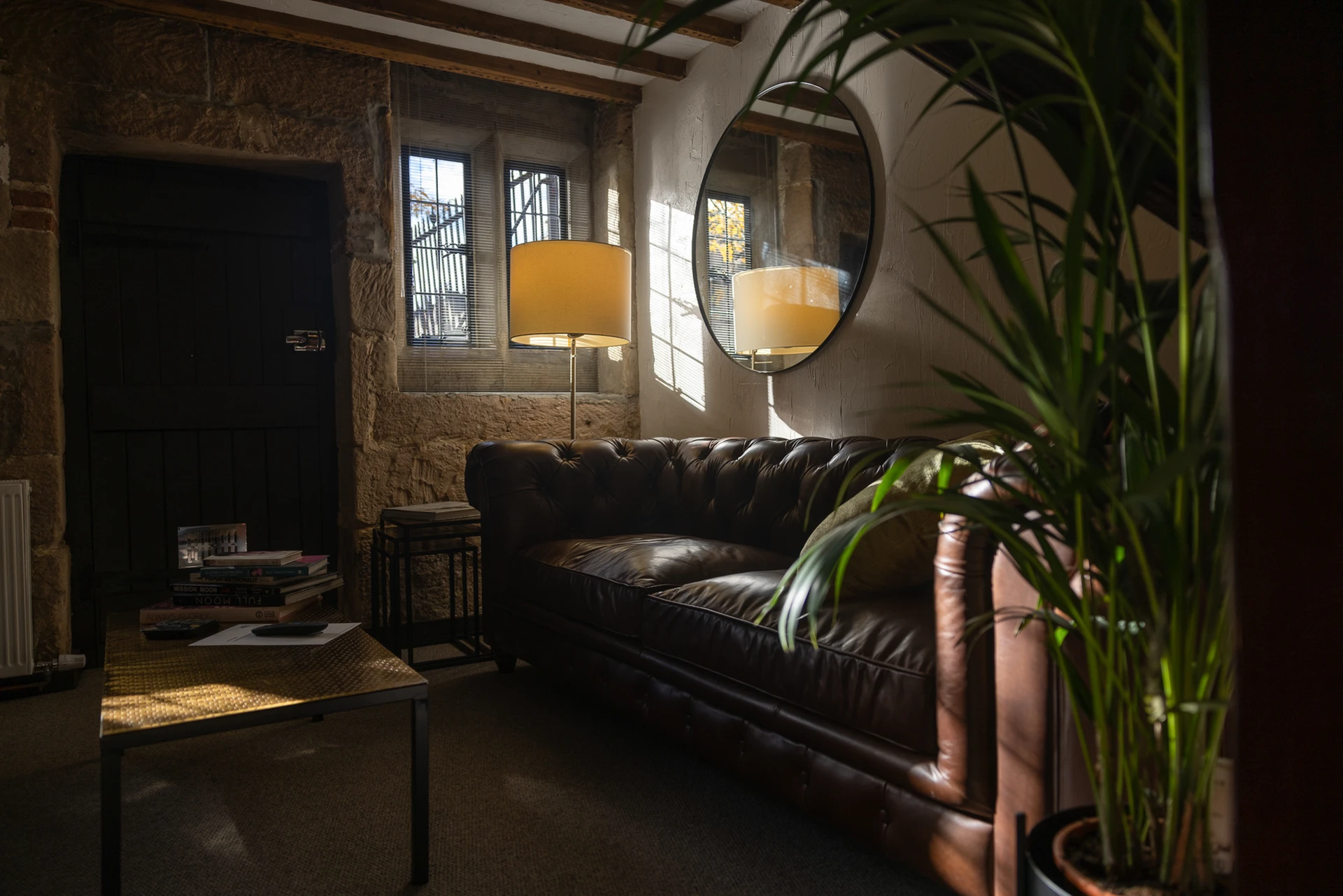 Sitting room with stone window and exposed beams at 42 Church Street