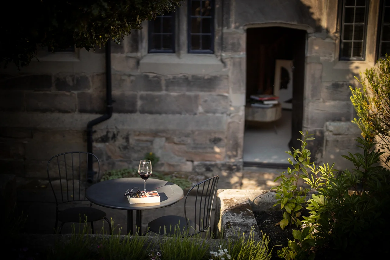 Shared garden seating beside the cottages at 46 Church Street