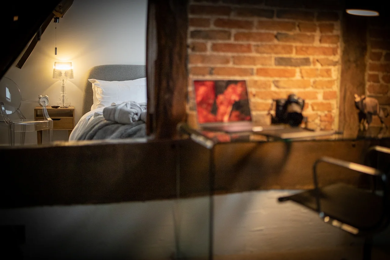 Bedroom mirror and exposed brickwork at 46 Church Street