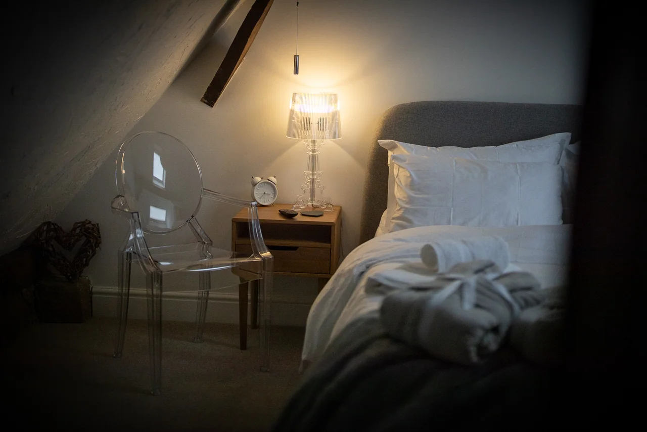 Bed beneath sloping ceilings at 46 Church Street
