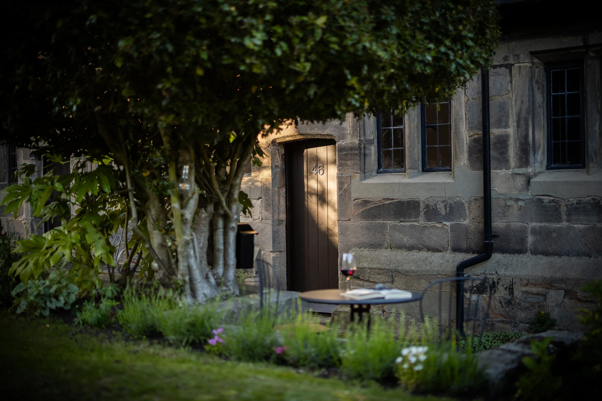 Cottage exterior and garden table at 46 Church Street, Ashbourne