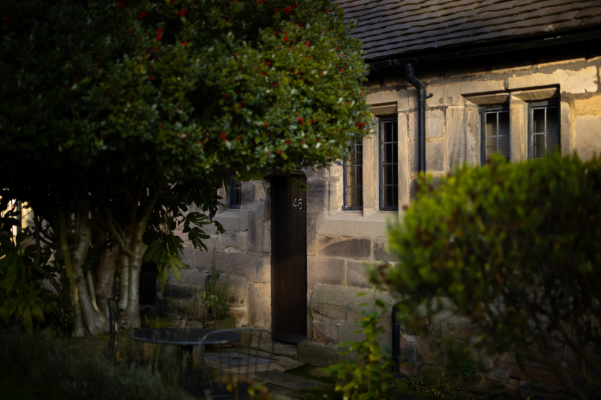 Cottage entrance framed by greenery at 46 Church Street, Ashbourne