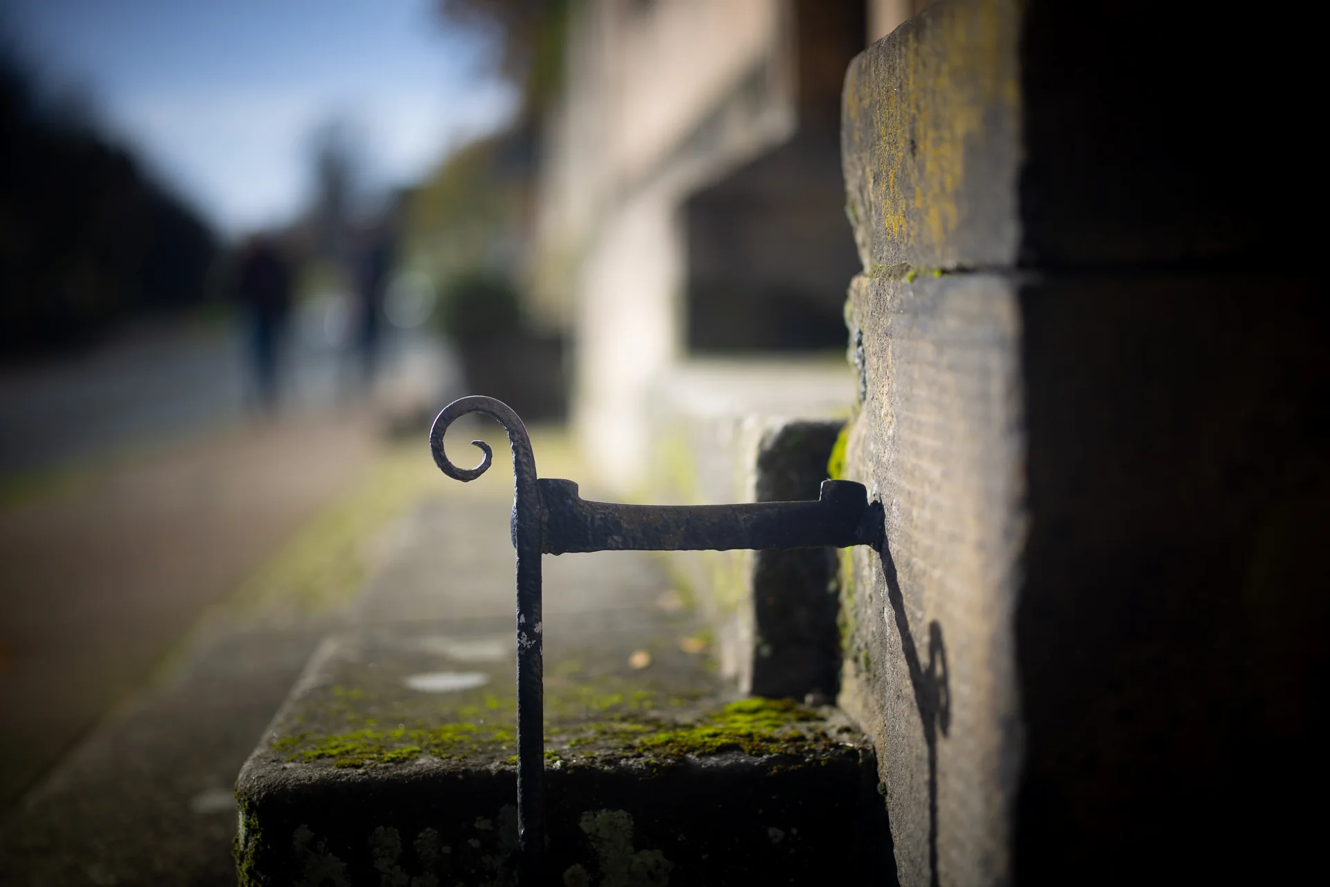 Iron boot scraper beside a stone doorway in Ashbourne